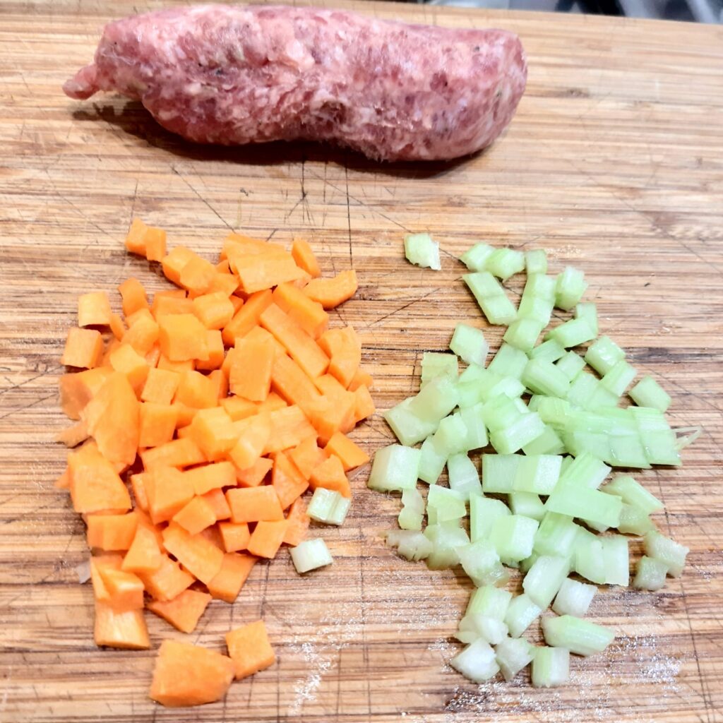 Gnocchi di patate e carote con ragù bianco di salsiccia