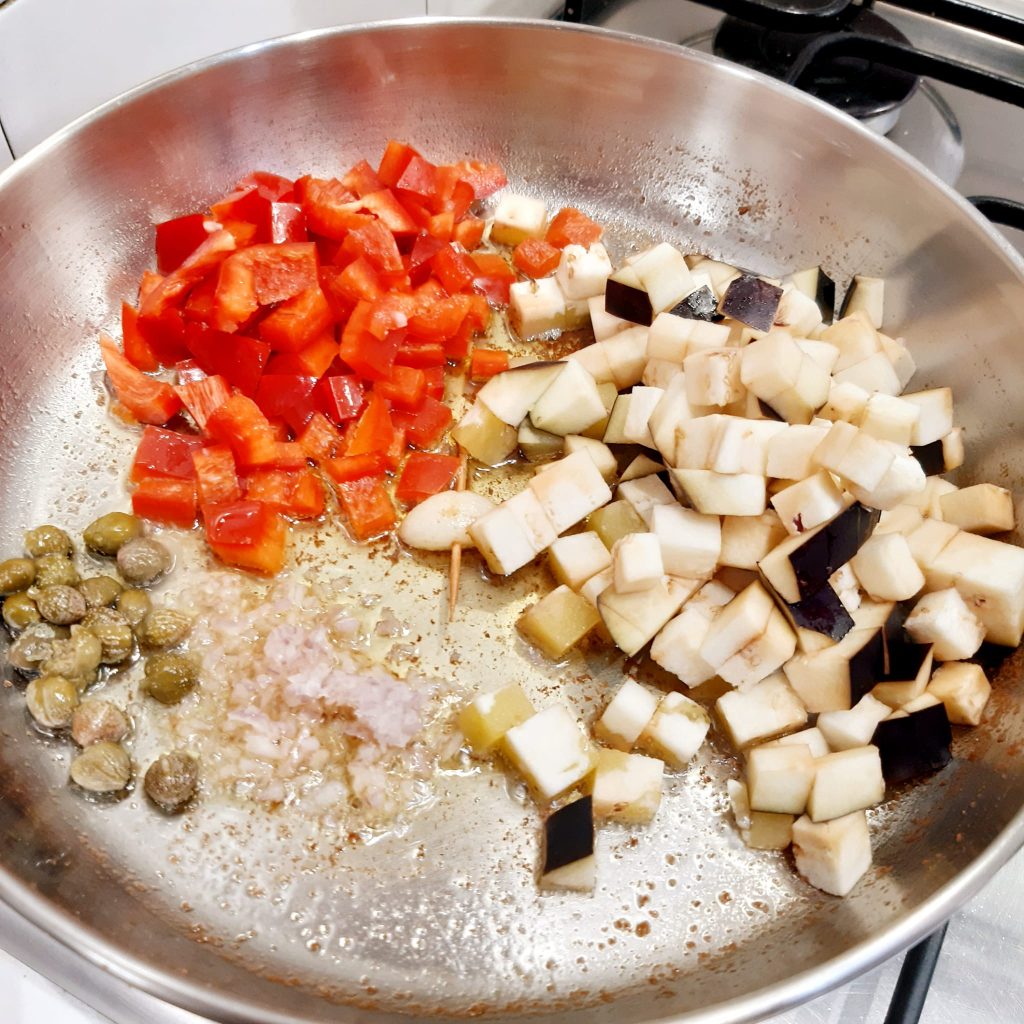 orecchiette con melanzane peperoni e ricotta salata